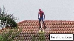 'Spider-Man' seen pressure washing roof of Florida home during rainstorm